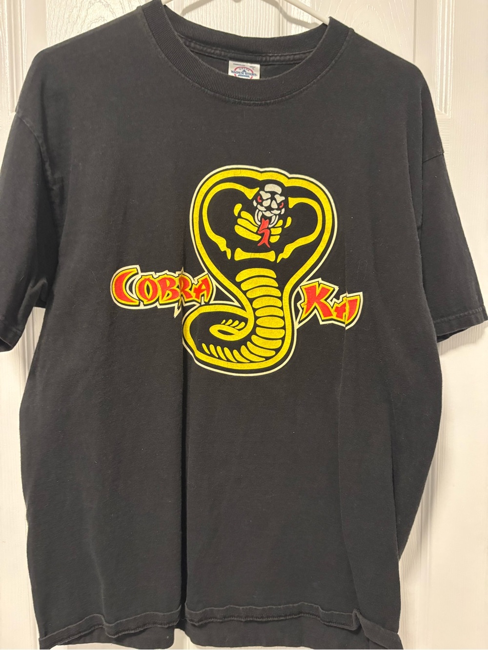 Delta Black Cobra Kai Graphic Tee with Yellow and Red Logo